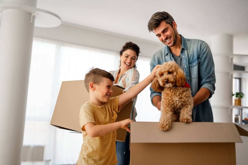 New home. Parents with child moving in new house, property mortgage and real estate investment.